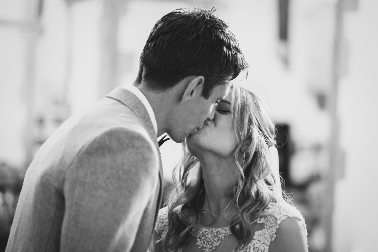 Black and white romantic wedding portrait showing an intimate moment between newlyweds.