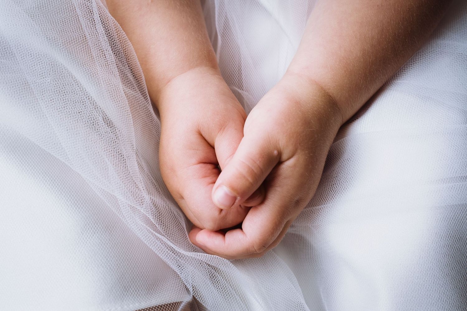 Bridesmaid's hands in her lap