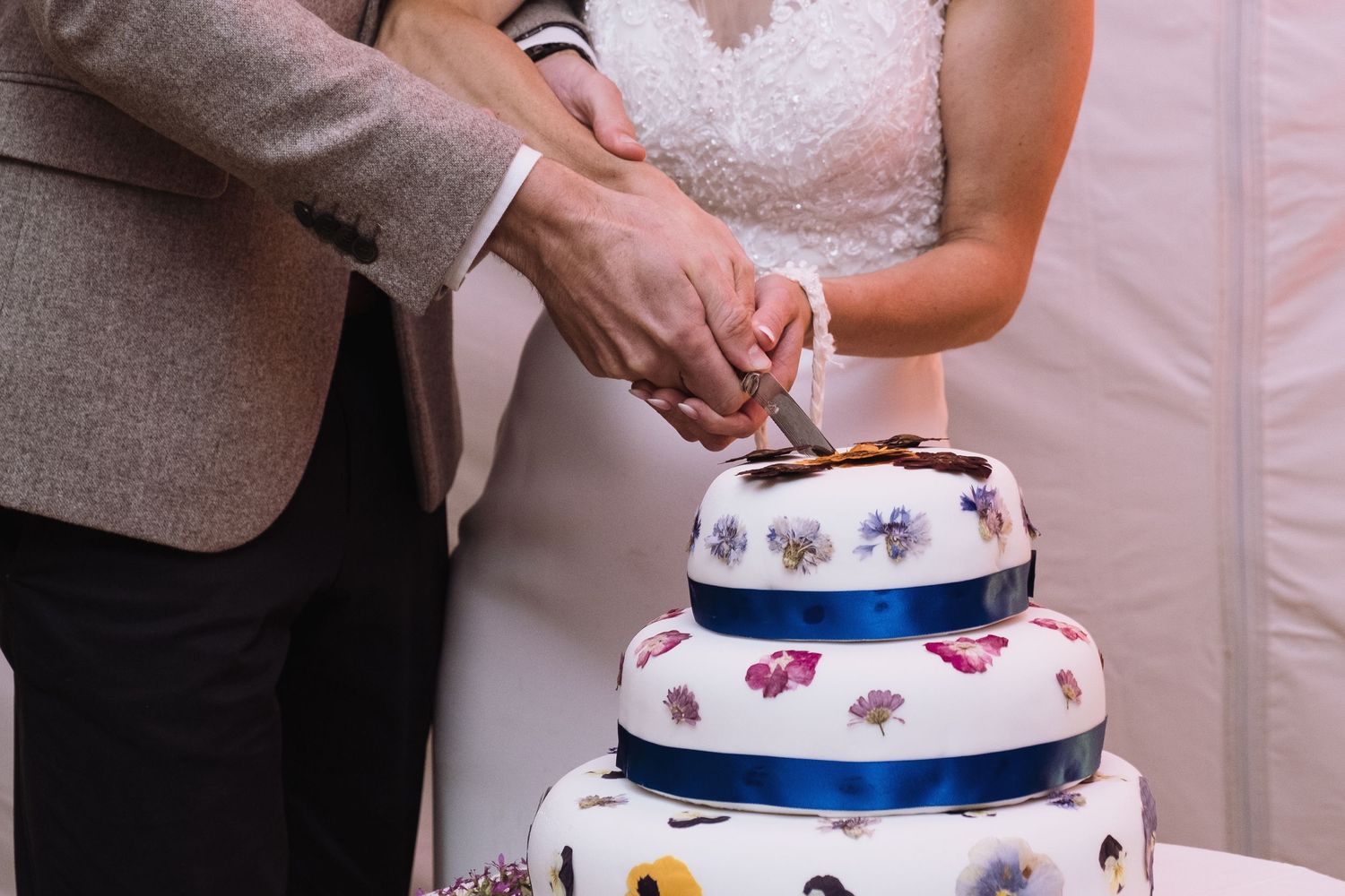 Bride and groom cutting the cake