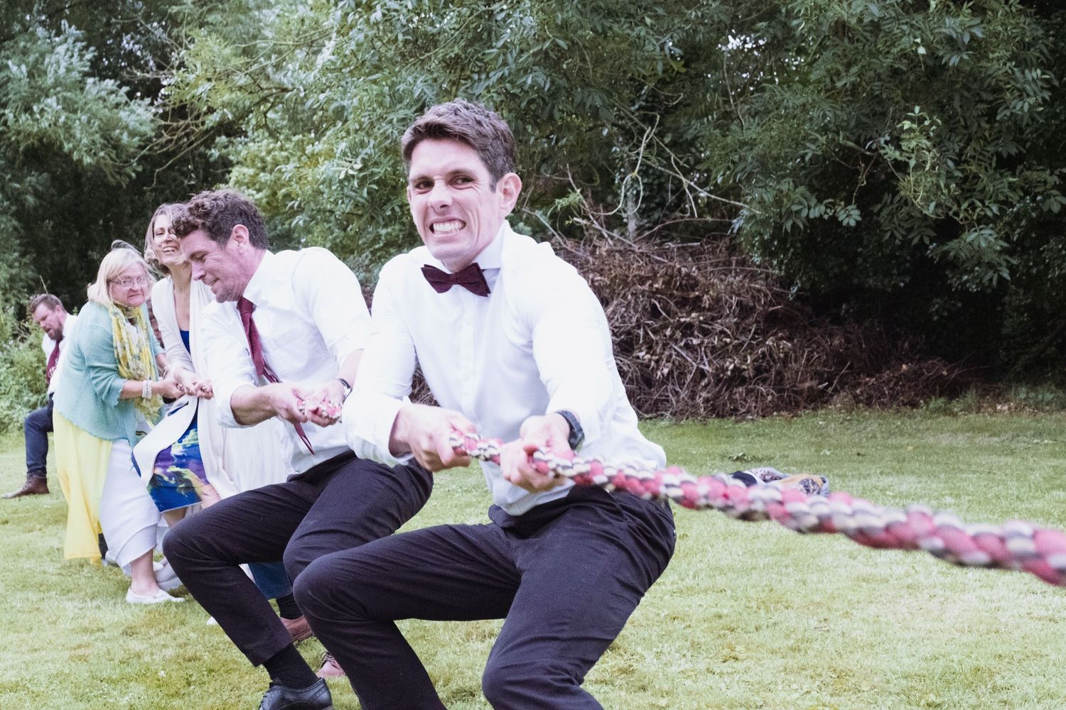 Groom playing tug-of-war