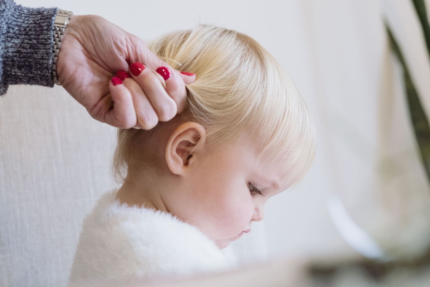 Young bridesmaid has her hair done