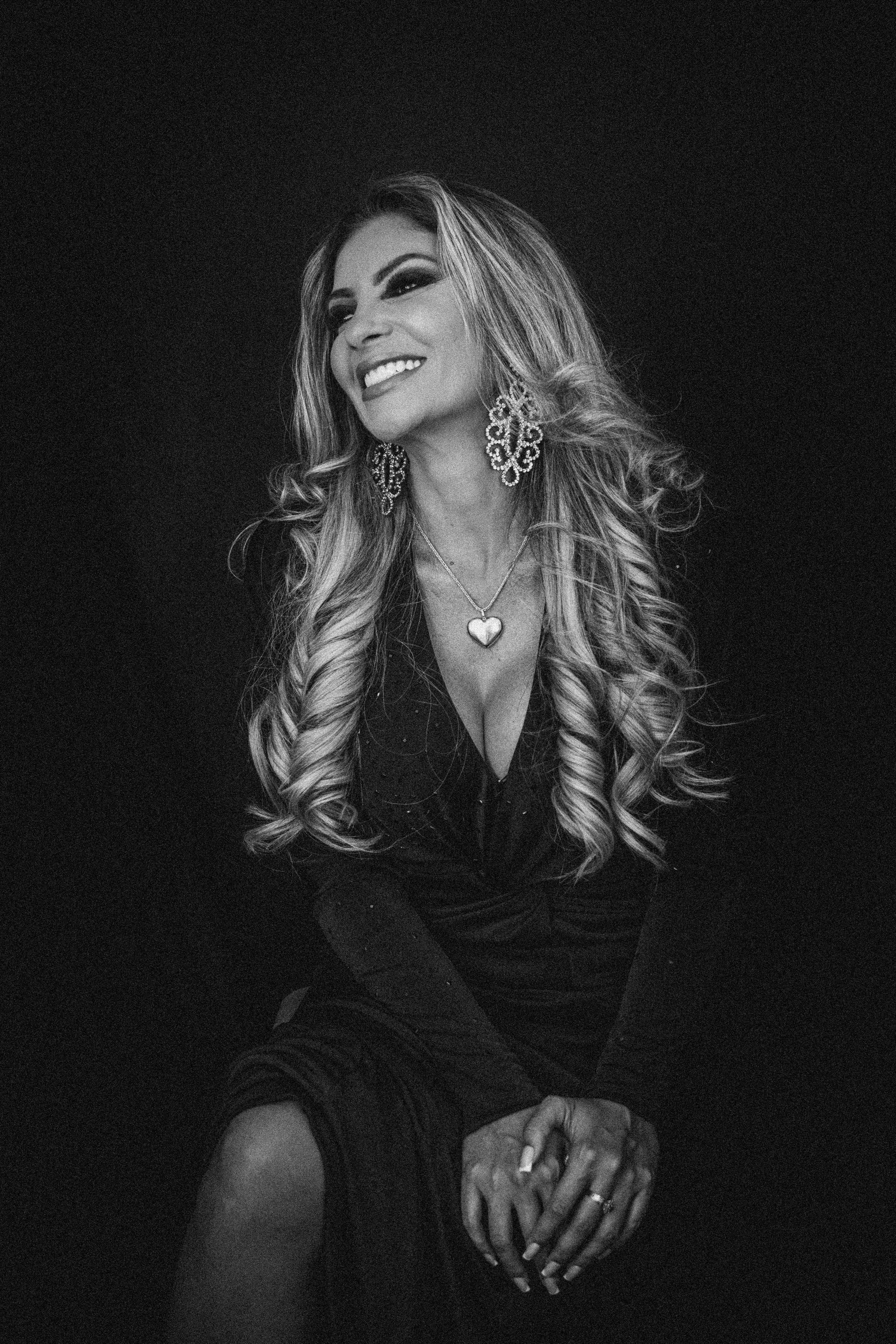 Elegant black and white portraits featuring jewelry and evening wear.