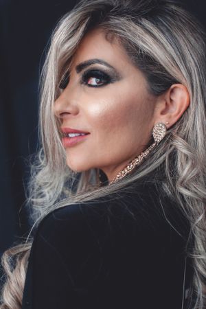 Close-up beauty shots highlighting silver jewelry and dramatic makeup.