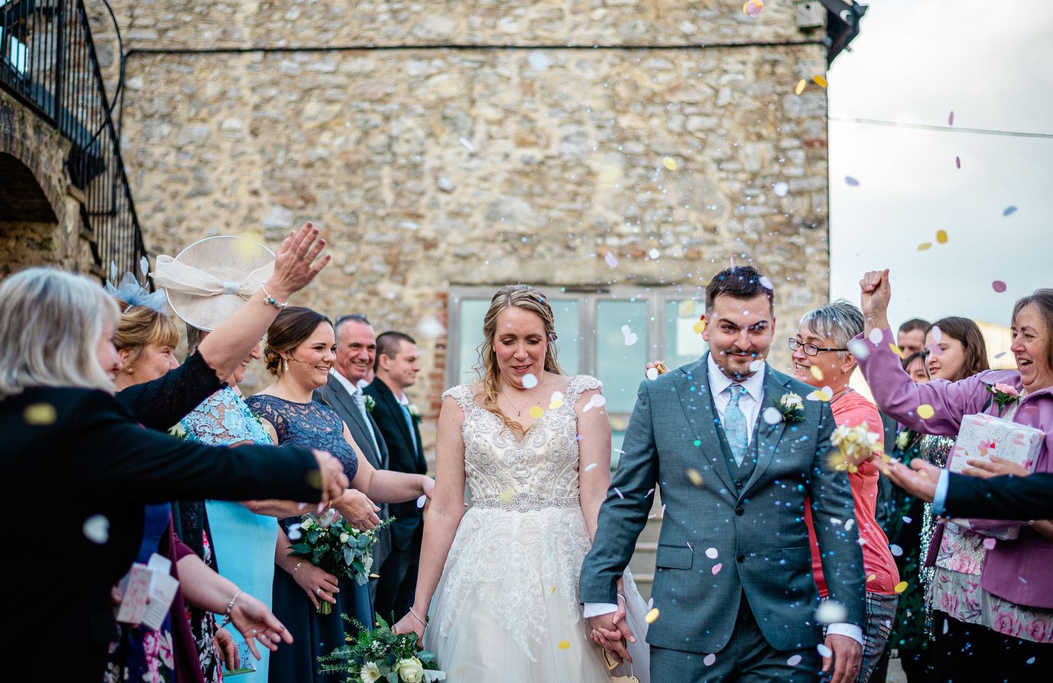Husband and wife walking through confetti