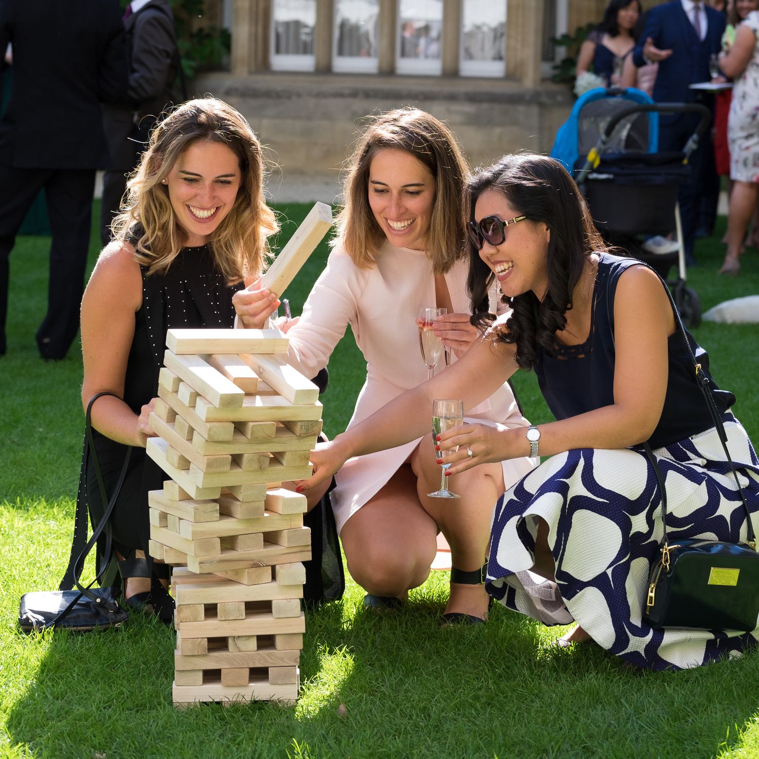 candid image of guests playing lawn games in the sun