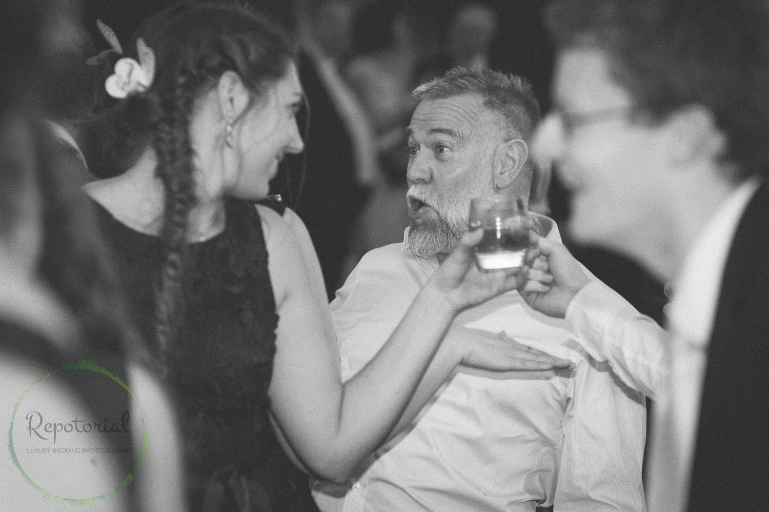 monochrome candid wedding capture of people dancing