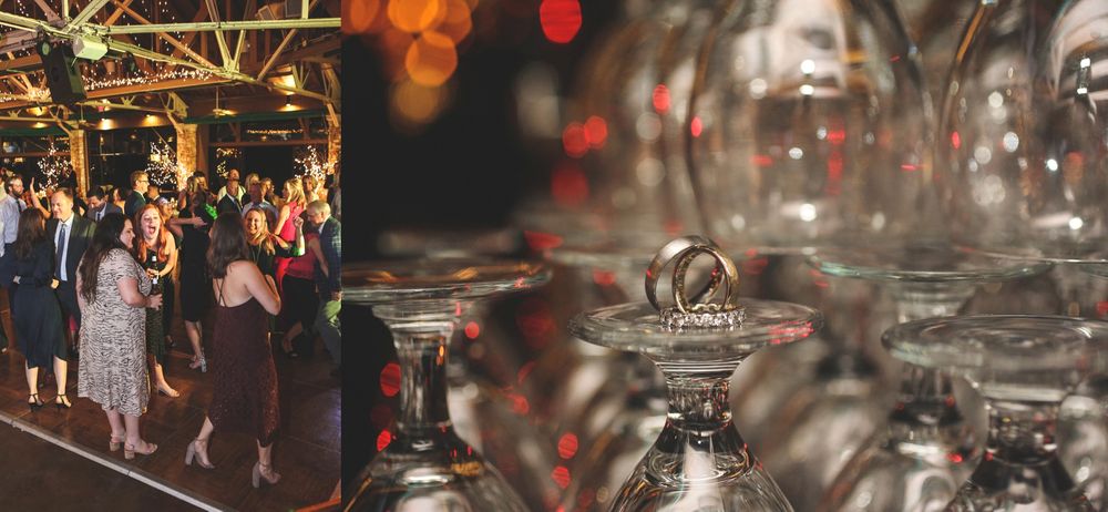 Wedding reception decor with bokeh lights and wine glasses creating an elegant atmosphere.