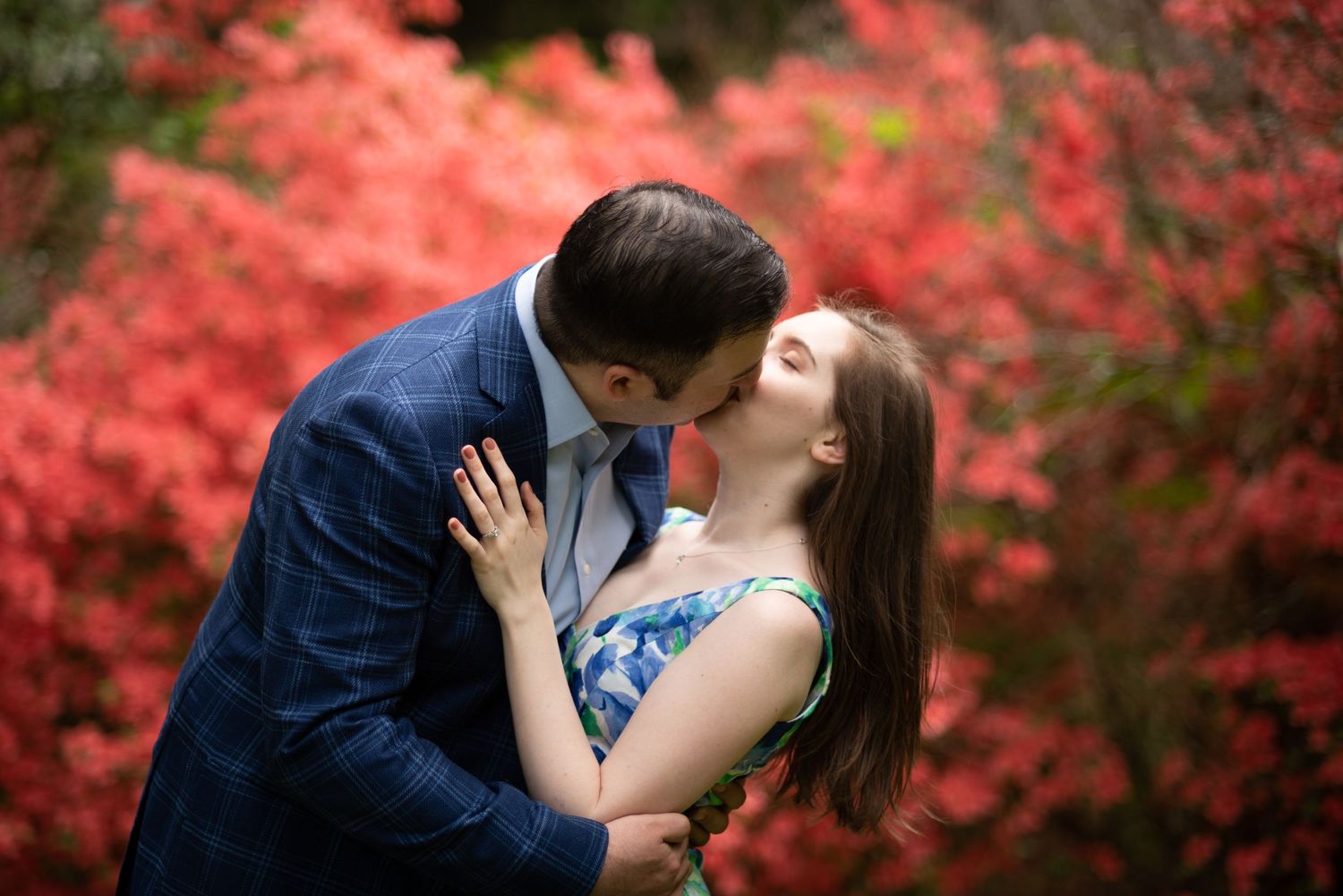 Engagement portraits at maudslay state park Newburyport red flowers couple kiss Leah Ramuglia Photography