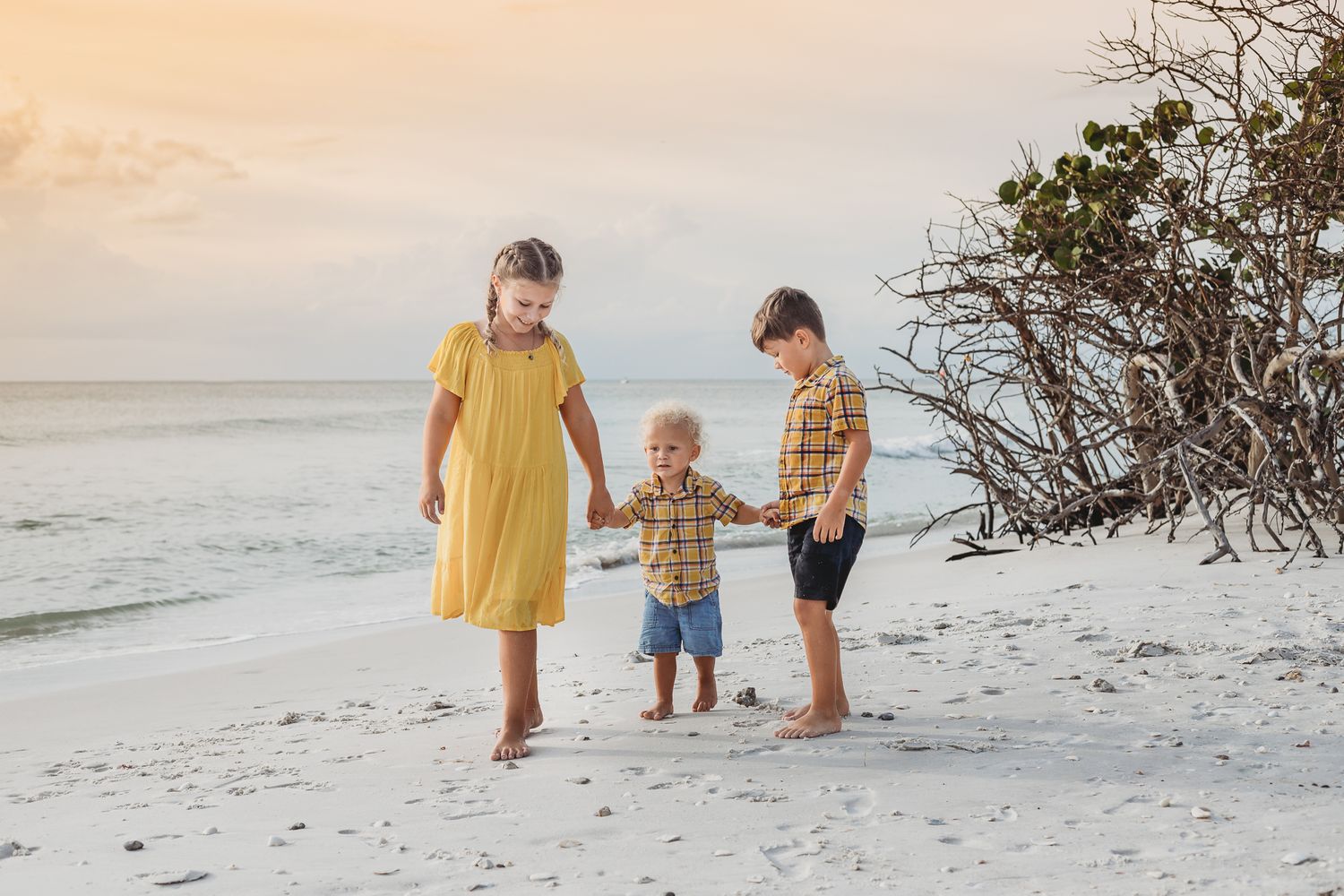 Kids at the beach in yellow