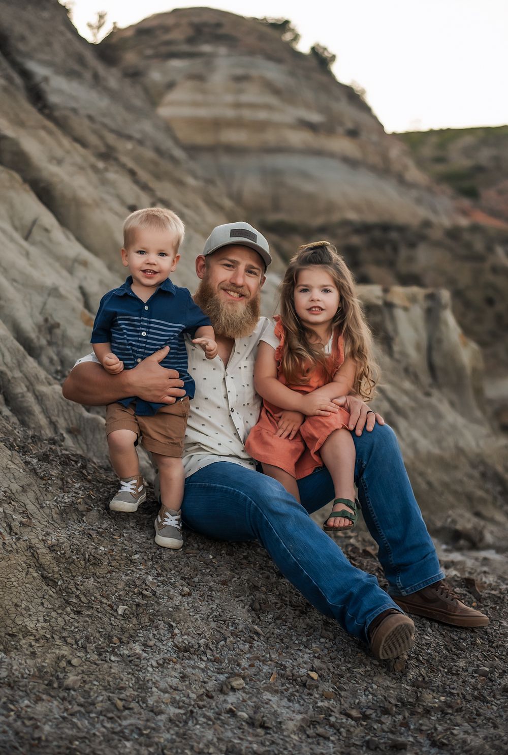 Dad with kids during lifestyle session - Badlands photographer serving southwest North Dakota