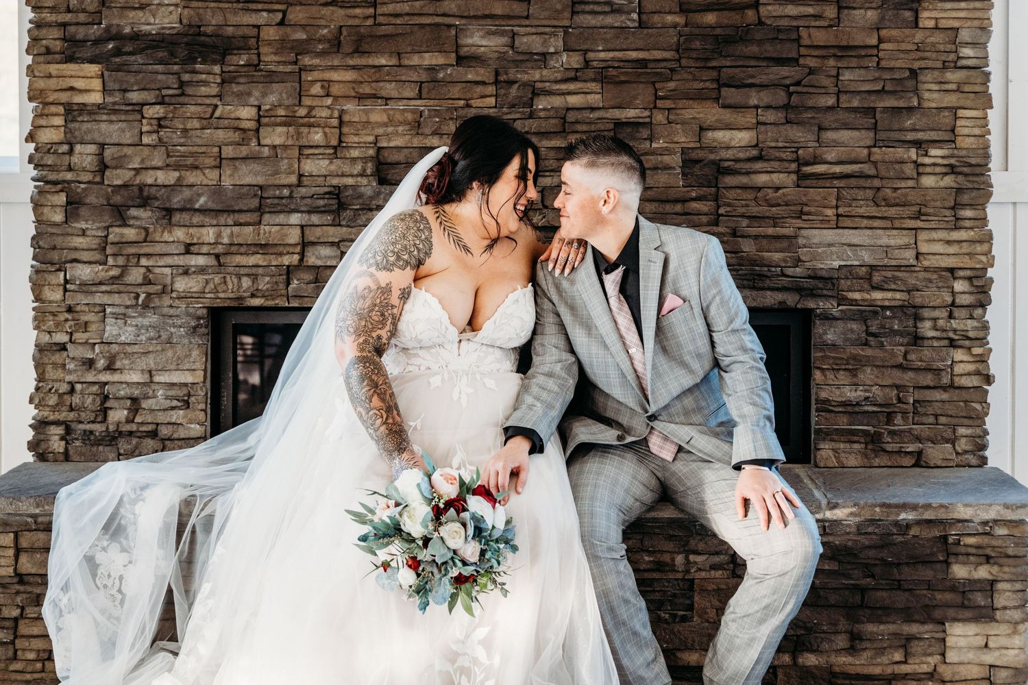 Lesbian couple share a kiss inside Bailey Barns Venue in Fairview, WV