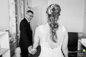 Black and white wedding preparation photos showing intimate moments and details.