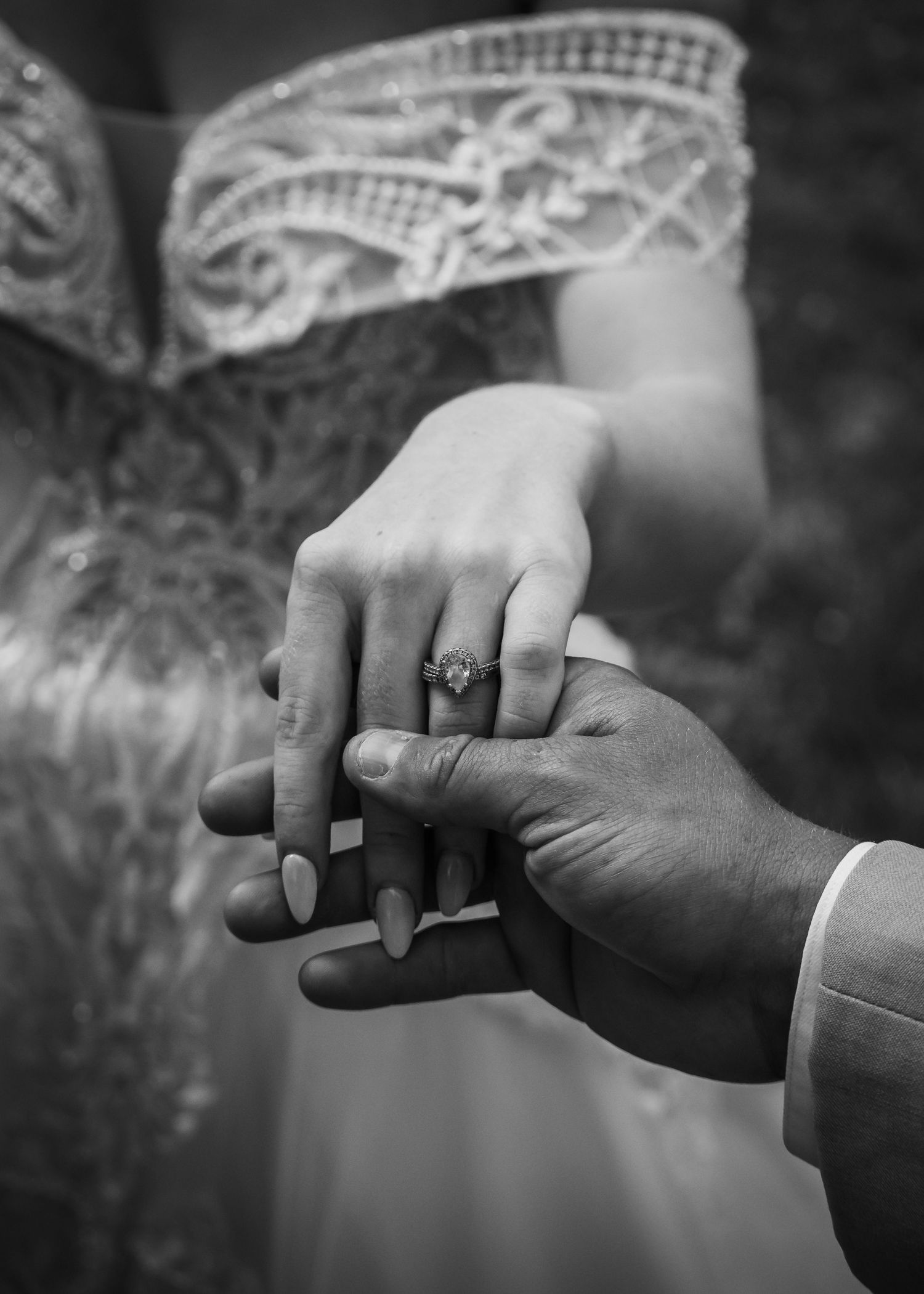 close up of wedding band on brides hand