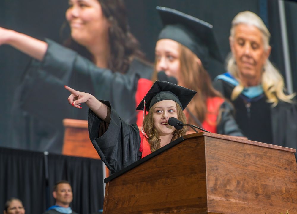 girl pointing to audience