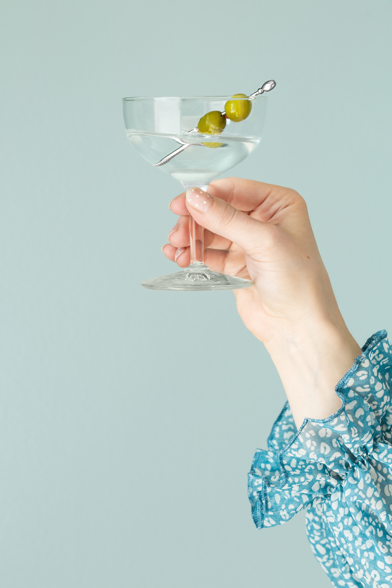 hand holding martini, food photography