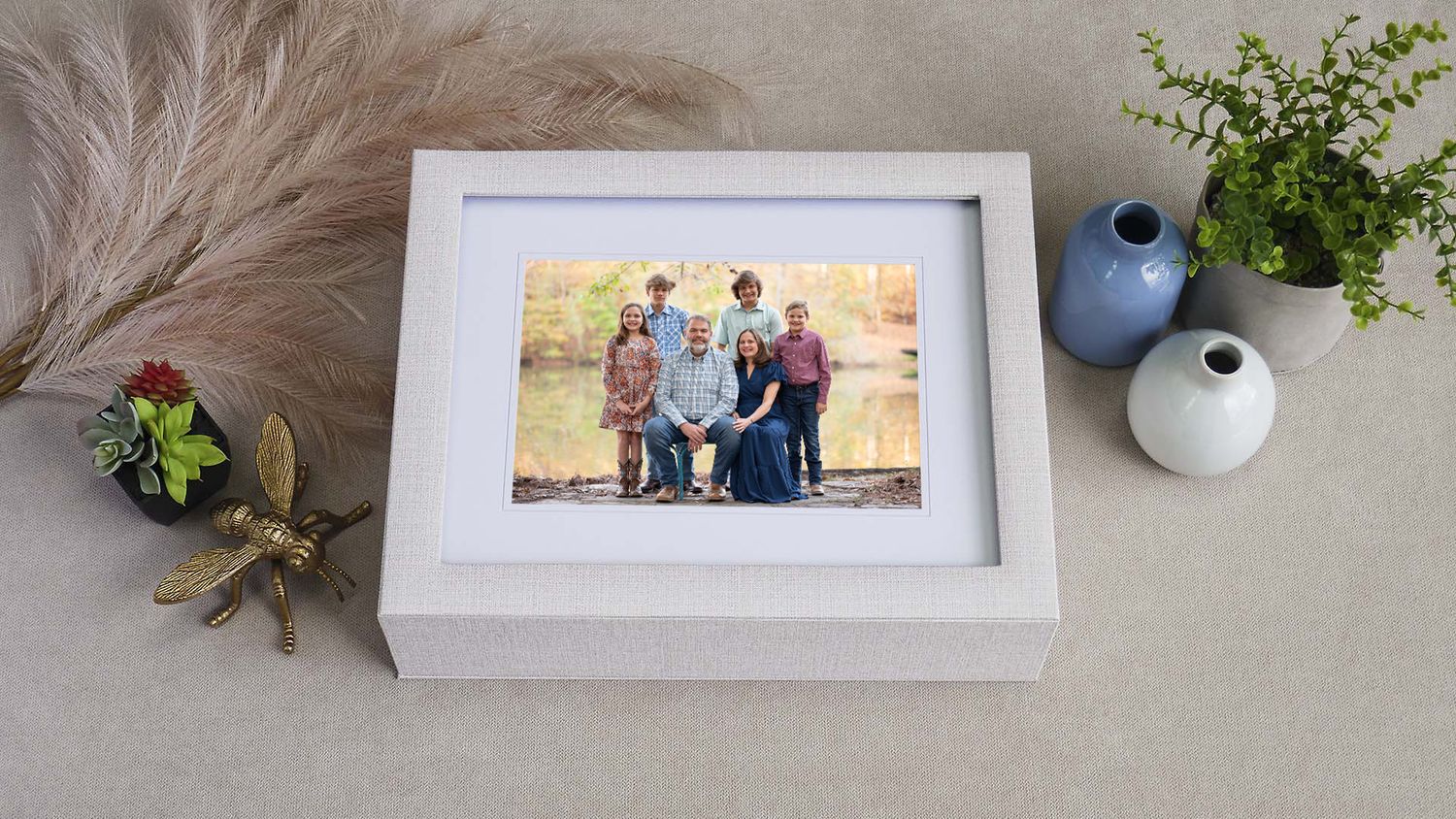 Portrait print box with a display window feature a matted family portrait in front of lake in Chelsea