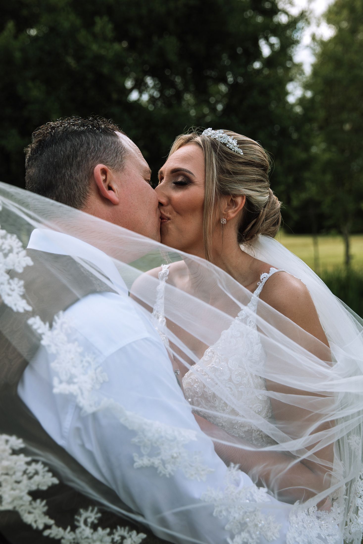 Bride and groom kissing at Ardencote Manor