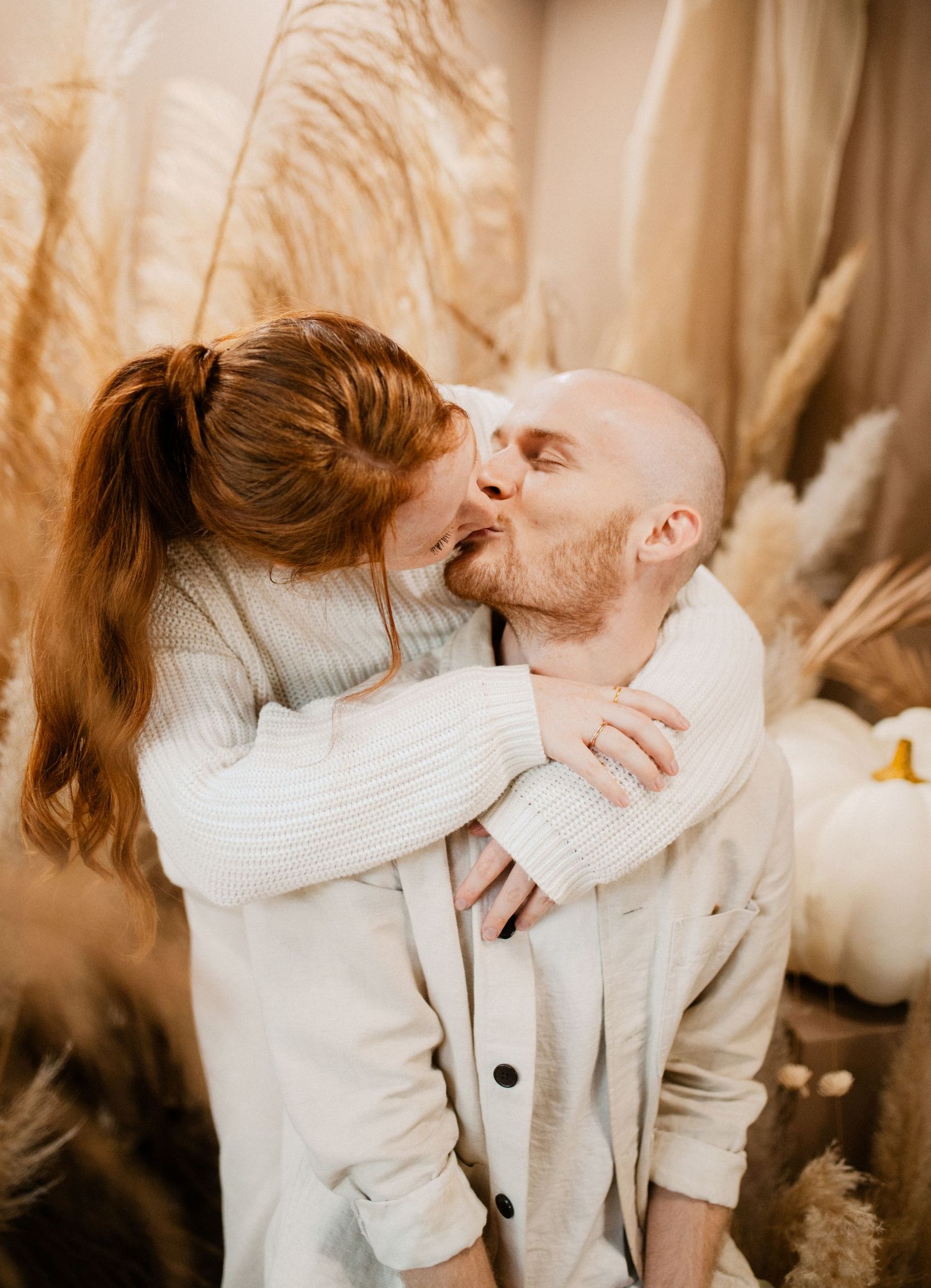 Series of intimate lifestyle photos showing tender moments in warm neutral tones.
