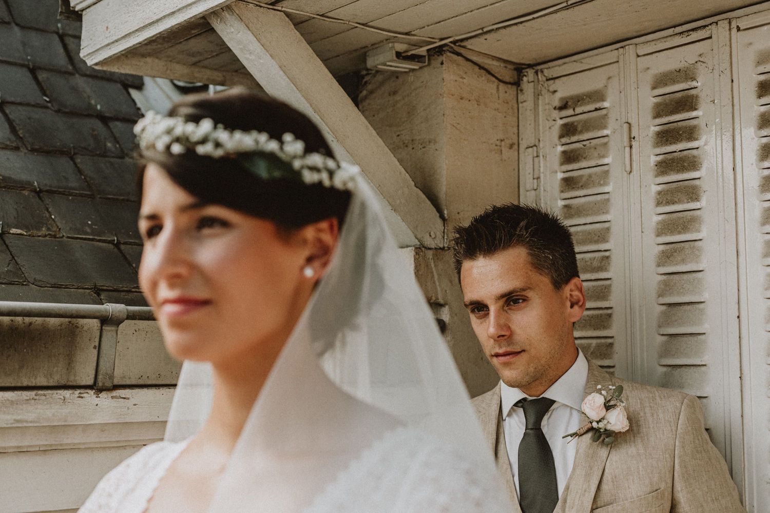 bride and groom looking at the same direction after their wedding in paris