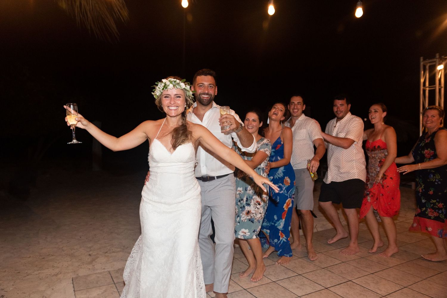 Wedding conga line guest dancing destination wedding Americans in Aruba Leah Ramuglia Photography