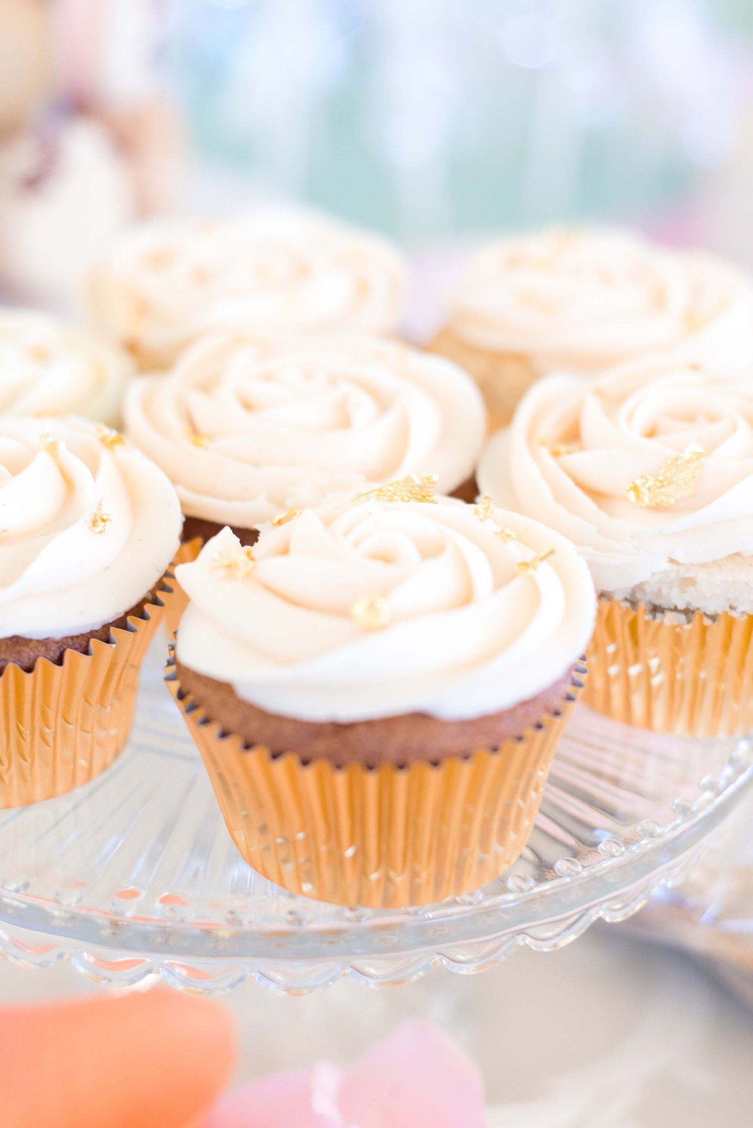 rose design cupcakes on a dessert table at a baby shower in sugar land texas