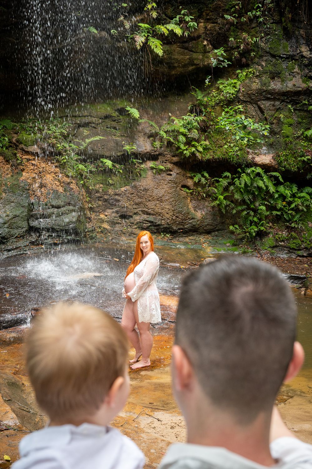 Dad and Son watch over as Mum is posing for her maternity photoshoot