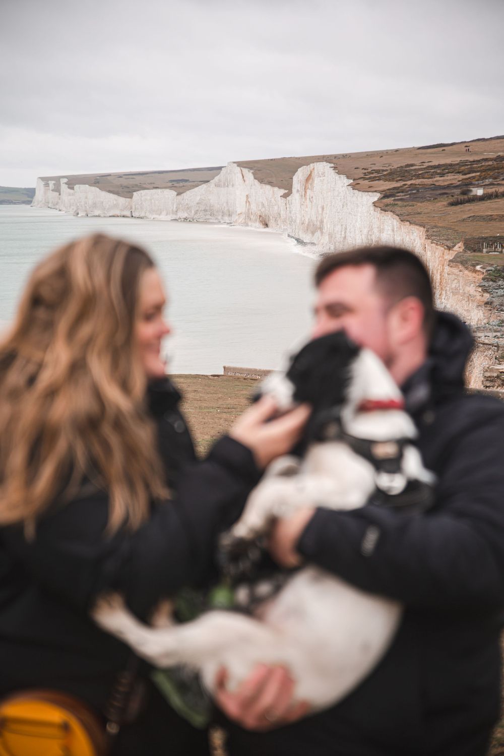 A couple and their dog on the South Downs for a photoshoot
