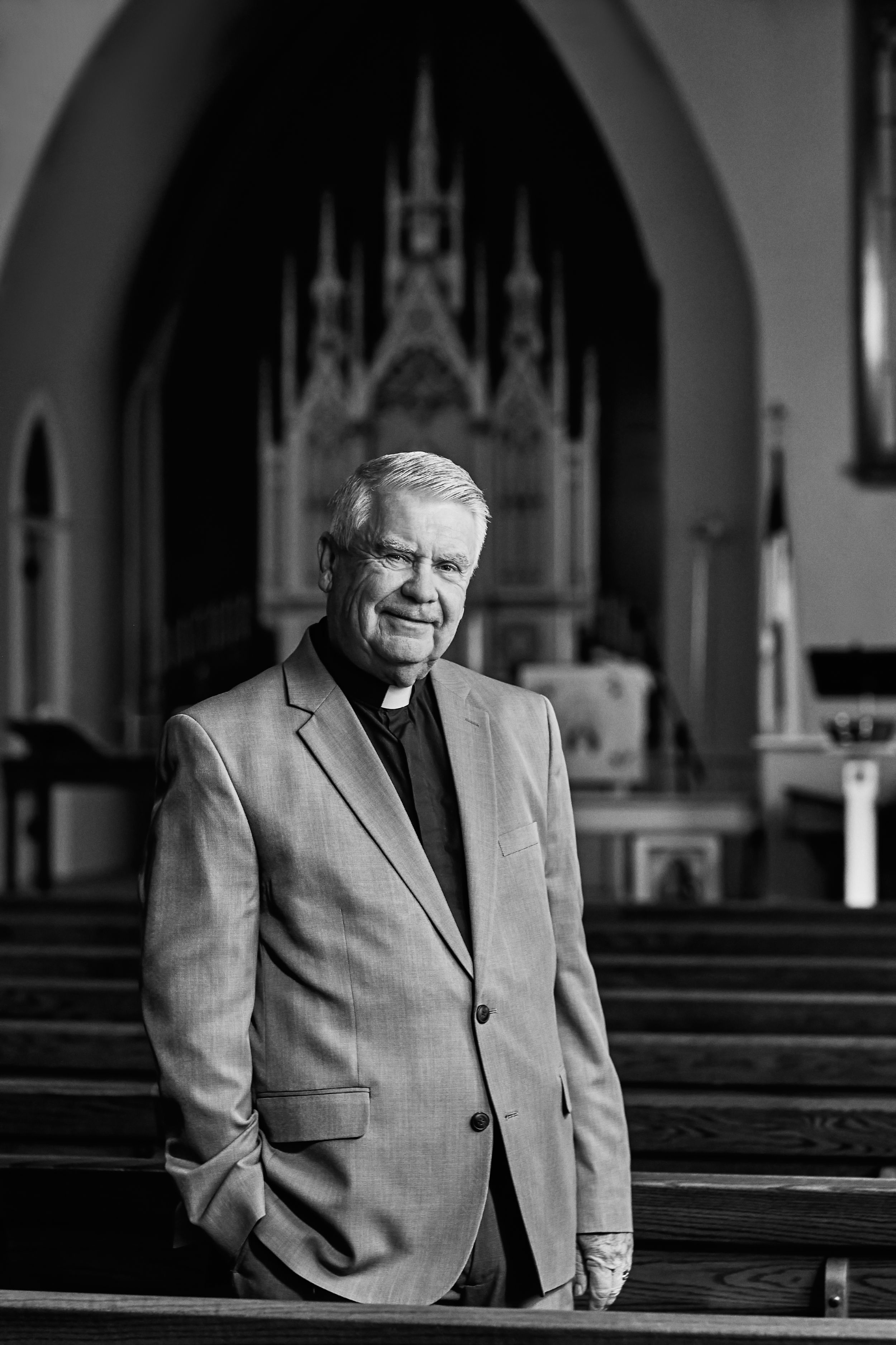 Black and white portraits of clergy member sitting in church pews.