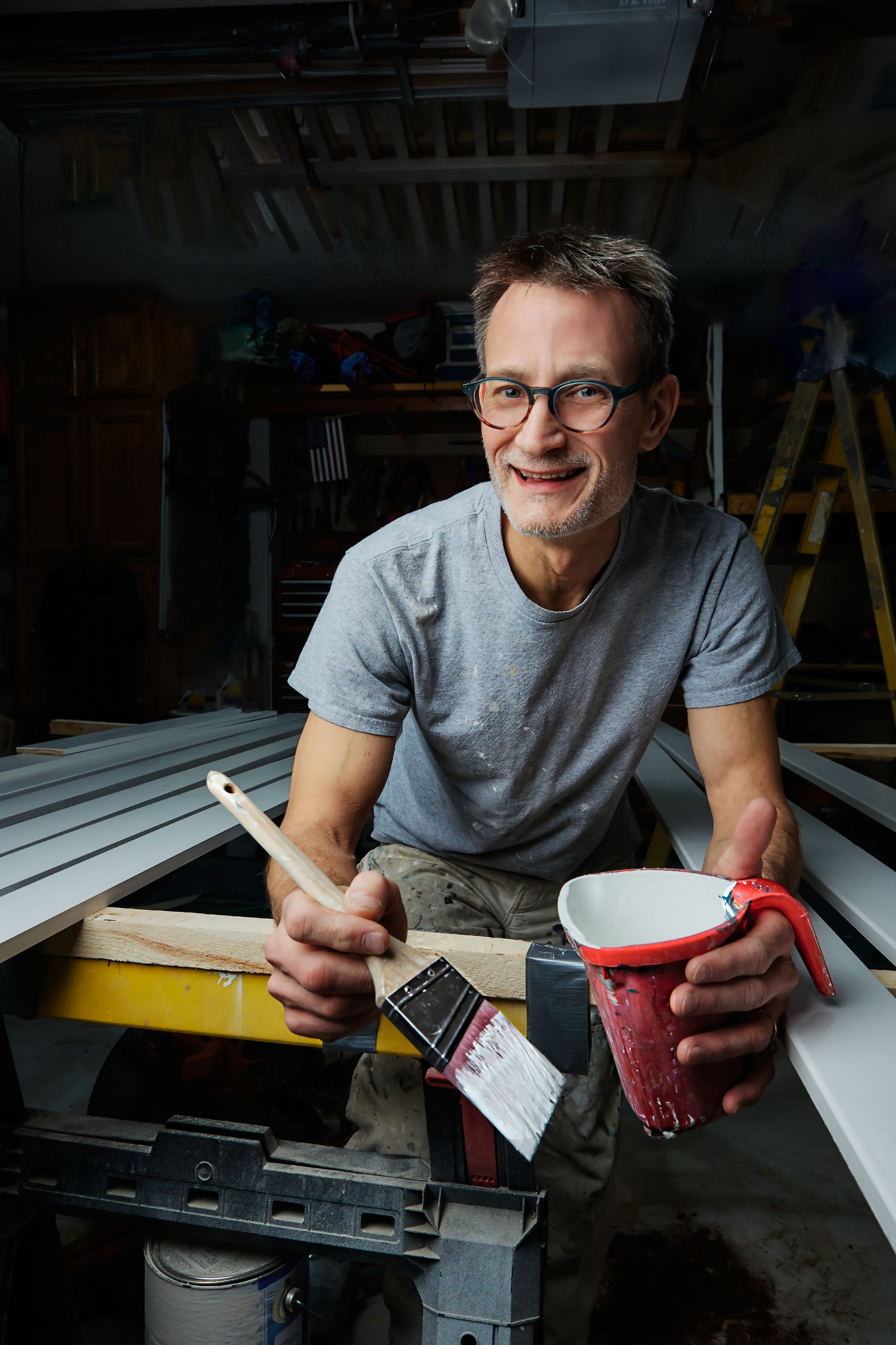 Workshop scene showing craftsman working with tools and materials.