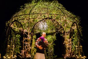 bride and father dancing in gazebo at night with twinkly lights