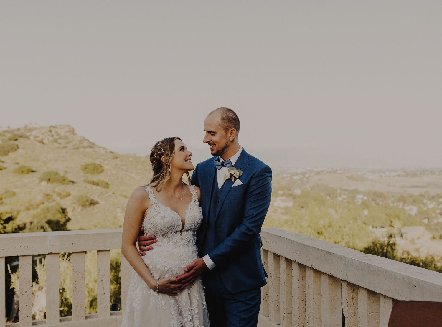 E Noelle Photography backyard wedding in Hidden Hills Los Angeles, bride and groom posing with pregnant belly