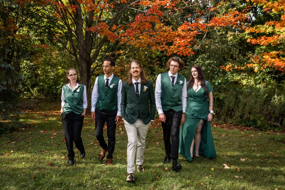 groom and wedding party outdoor candid walking fall autumn wedding photo in acton ontario