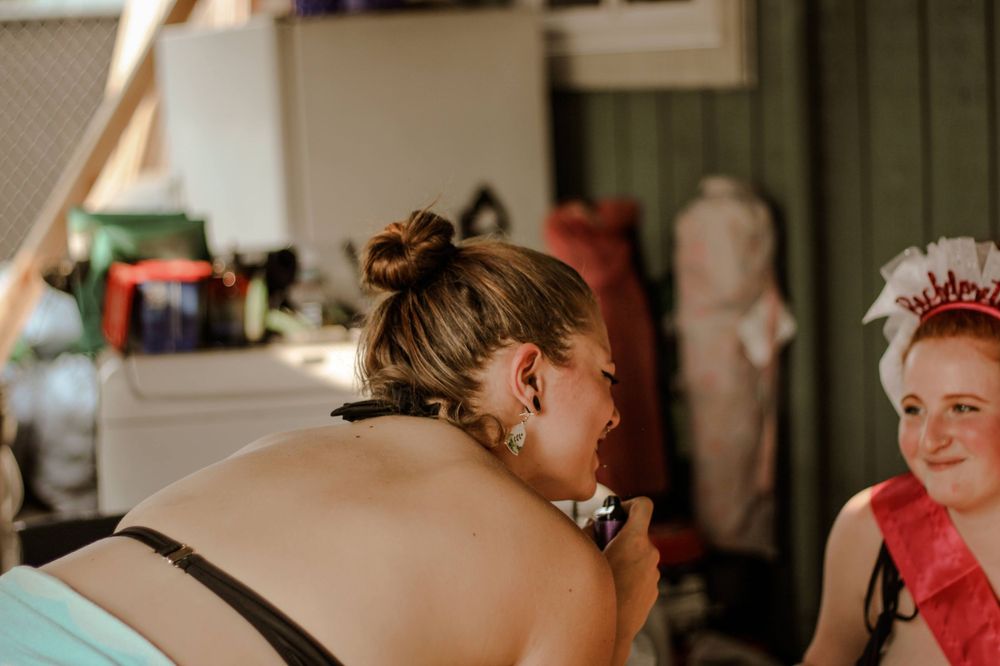 A bridesmaid sings to her bachelorette
