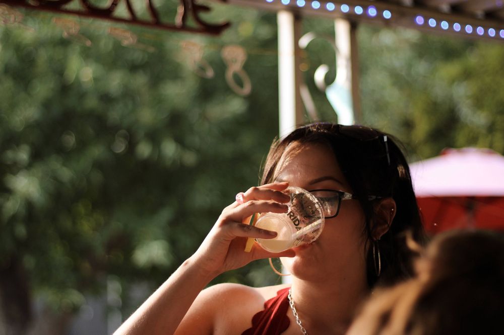 A bridesmaid drinking at a bachelorette party