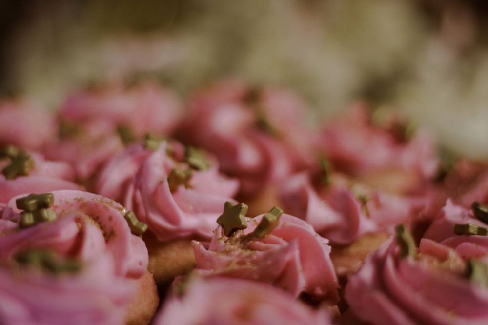 A tray of cupcakes at a baby shower