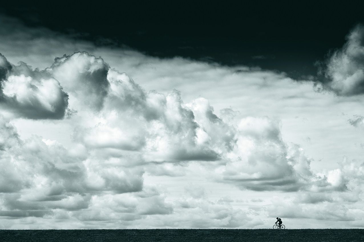 Cyclist with beautiful cloudy sky