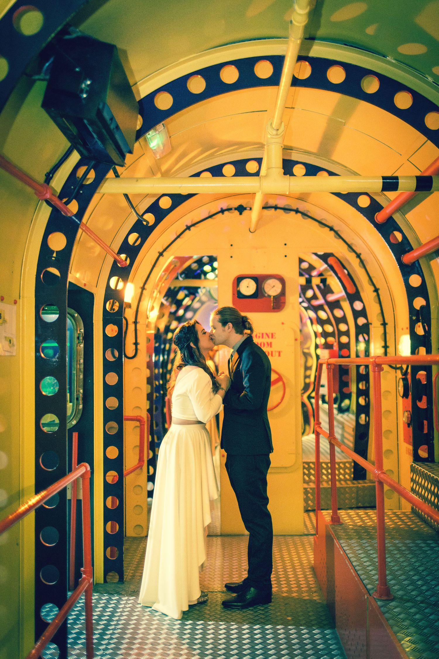 bride and groom's kiss in a yellow submarine