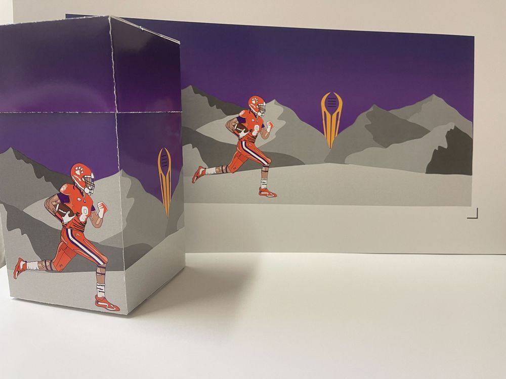 3D paper craft mockup showing a mountain scene with orange figure against purple background.