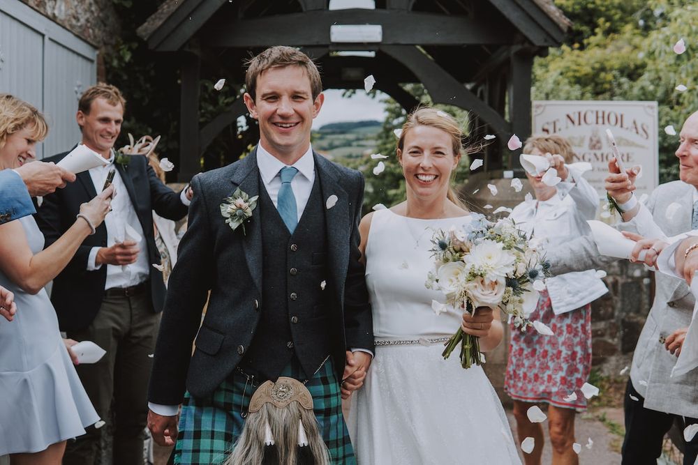 Candid wedding celebration moments with guests and couple in Scottish attire.