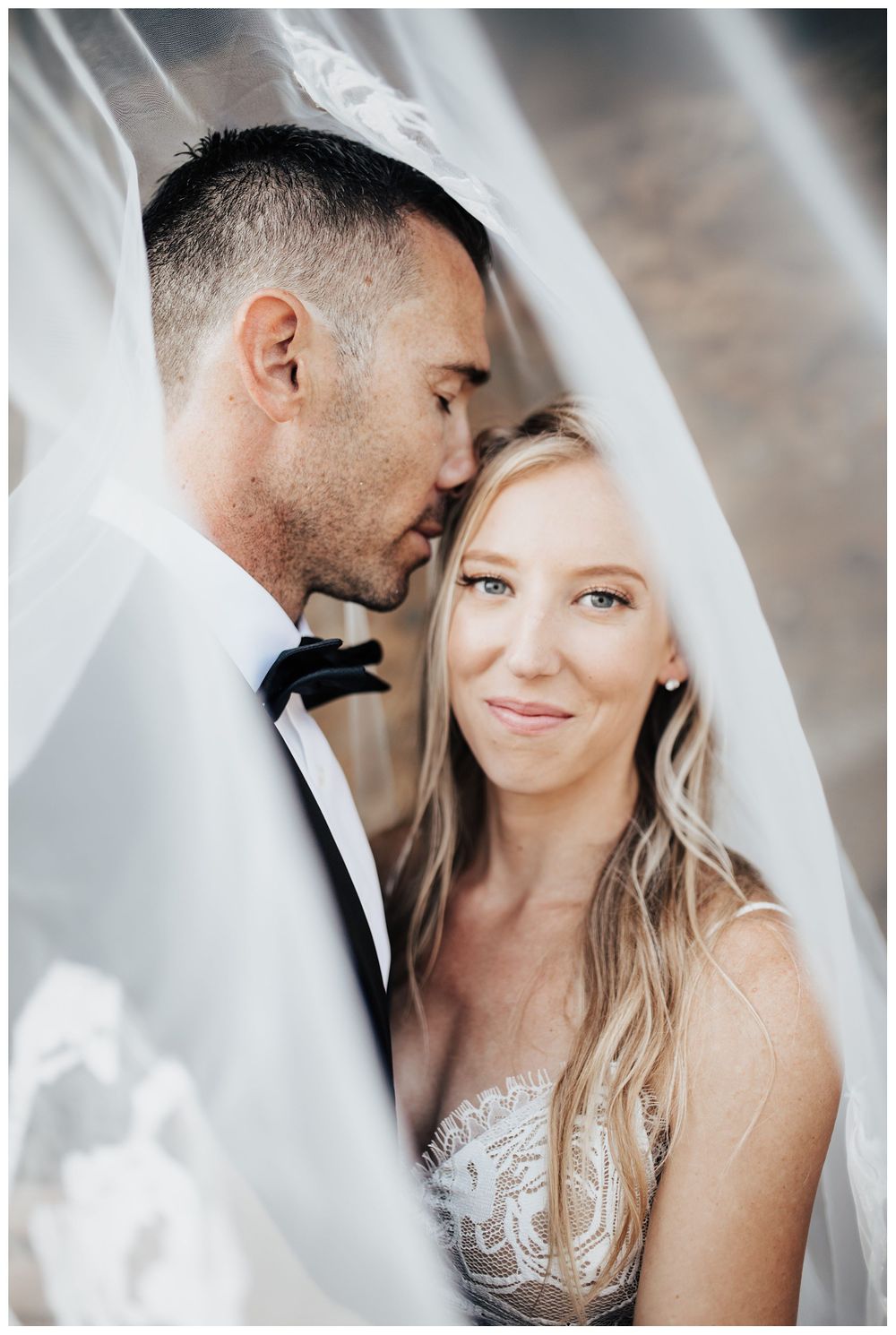 bride and groom under veil, wedding photo inspiration, veil wedding photo