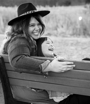 Mother daughter portrait laughing