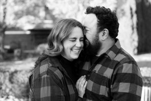 Laughing, kissing husband and white in black and white