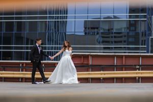 man and woman walk down the street
