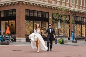man and woman walk down the street