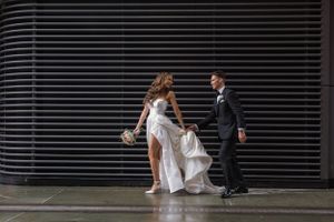 man and woman walk down the street
