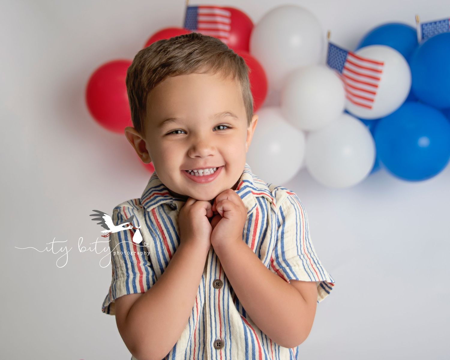 Big Brother Smiles during 4th of July Cake Smash 1 Year Avon Lake Ohio Photographer