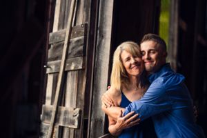 Family photography mama hugs grown son