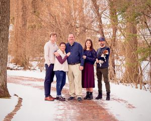 winter family photography brick driveway in snow
