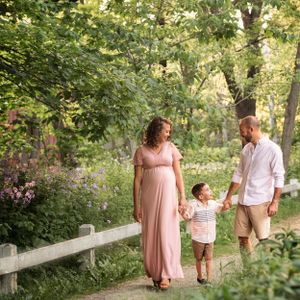 family with small boy maternity photography walking along path