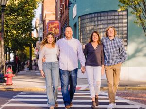 family of four crossing street urban photography session
